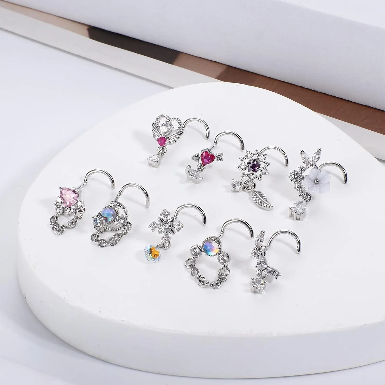 JOERICA 9 Pcs 20G Dangle Nose Rings Studs for Women Stainless Steel L Shaped Nose Studs Heart Arrow Feather Snowflake Wing CZ Dangling Nose Piercing Jewelry